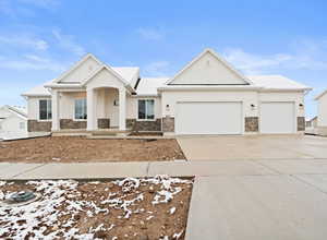 View of front facade featuring a garage