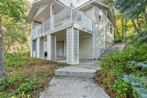 Back of house with a balcony