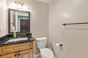 Bathroom #2 Main Floor featuring vanity and toilet