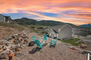 Yard at dusk featuring a mountain view