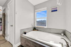 Bathroom with a relaxing tiled tub