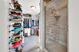 Spacious closet featuring carpet floors