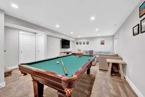 Recreation room with billiards and carpet