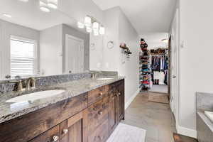 Bathroom featuring vanity and a bathtub