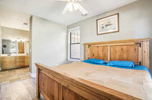 Bedroom featuring sink, ceiling fan, and light hardwood / wood-style floors