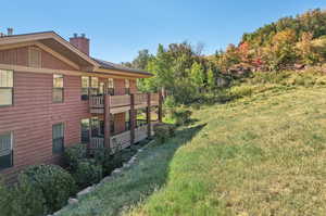 View of yard featuring a wooden deck