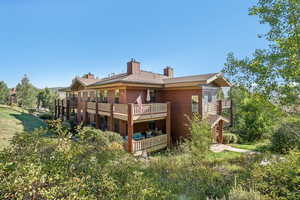 Rear view of house featuring a deck