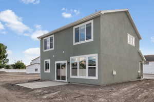 Back of property with a patio area