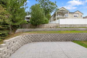 View of patio featuring a balcony