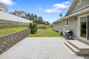 View of patio featuring area for grilling