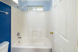 Bathroom with toilet and shower / washtub combination