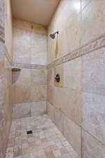 Bathroom featuring a tile shower