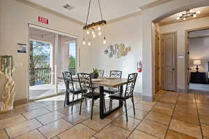 Dining room featuring crown molding