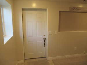 Outside Entryway featuring light tile patterned flooring