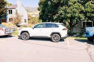 View of street parking in front of yard entrance to Farmington Trail (located between the grey home across the street and the neighboring white home to the North.