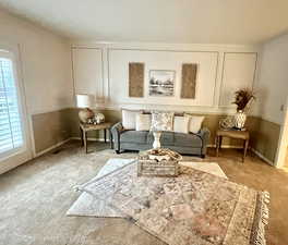 Sitting room with carpet flooring