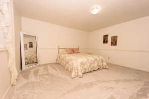 Bedroom featuring carpet