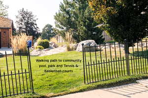 Trail to pool. Located between the two houses directly to the North on the same side of the street.