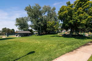 View of yard featuring a playground