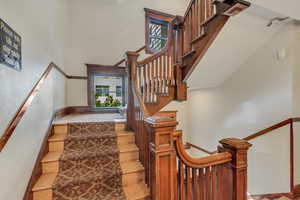 Stairs featuring hardwood