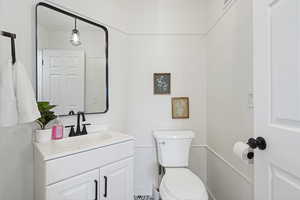 Bathroom featuring vanity and toilet