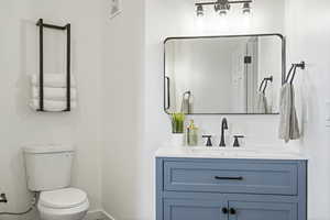 Bathroom with vanity and toilet