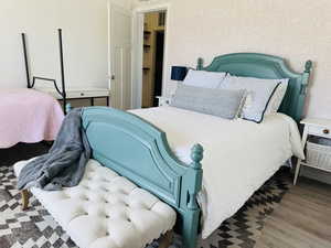 Bedroom with wood finished floors