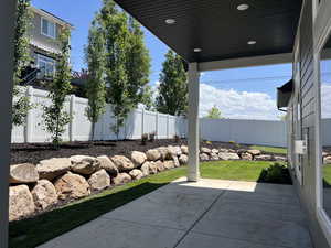 Fenced backyard featuring a patio area