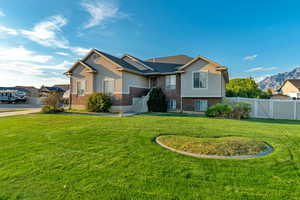 View of front of property with a front yard