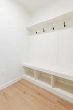 Mudroom with hardwood / wood-style flooring