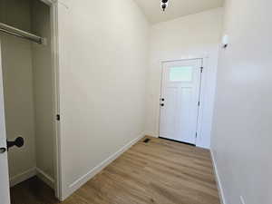 Entryway with light hardwood / wood-style flooring