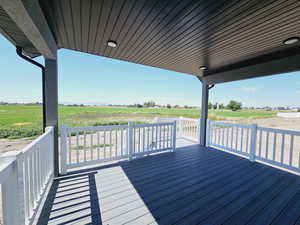 Wooden deck featuring a rural view