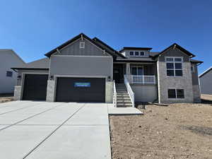 View of front facade featuring a garage