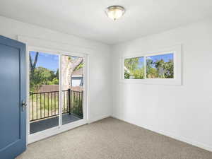 Spare room featuring light colored carpet