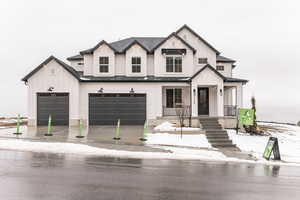 Modern farmhouse with covered porch and a garage