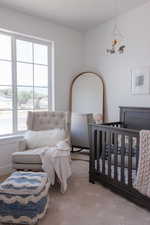 Bedroom featuring an inviting chandelier