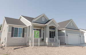 Craftsman house featuring a garage