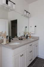 Bathroom with vanity and tile patterned flooring