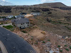 Birds eye view of property with a mountain view