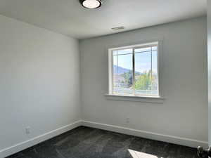 Fourth bedroom with new carpet, a nice closet and a big window