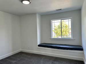 Second bedroom with a nice front window, a padded window seat and closet