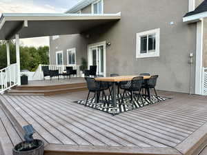 View of amazing composite decking, both full sun and covered next to the pool