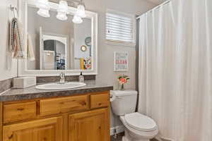 Bathroom with vanity and toilet