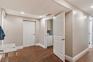 Interior space with washer / clothes dryer and dark hardwood / wood-style floors