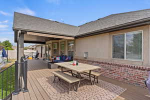 Wooden terrace with an outdoor hangout area