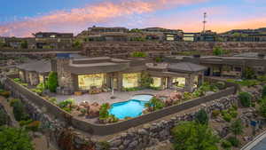 Exterior space with a residential view, a fenced in pool, and a patio area