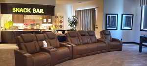 Home theater room featuring bar area and carpet