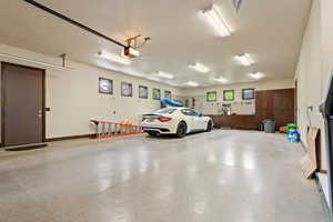 Garage featuring a garage door opener