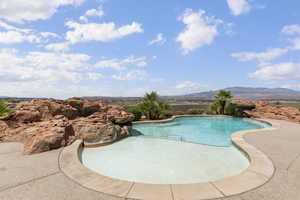 Outdoor pool with a mountain view