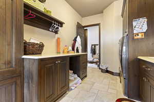 Interior space with stone tile flooring and baseboards